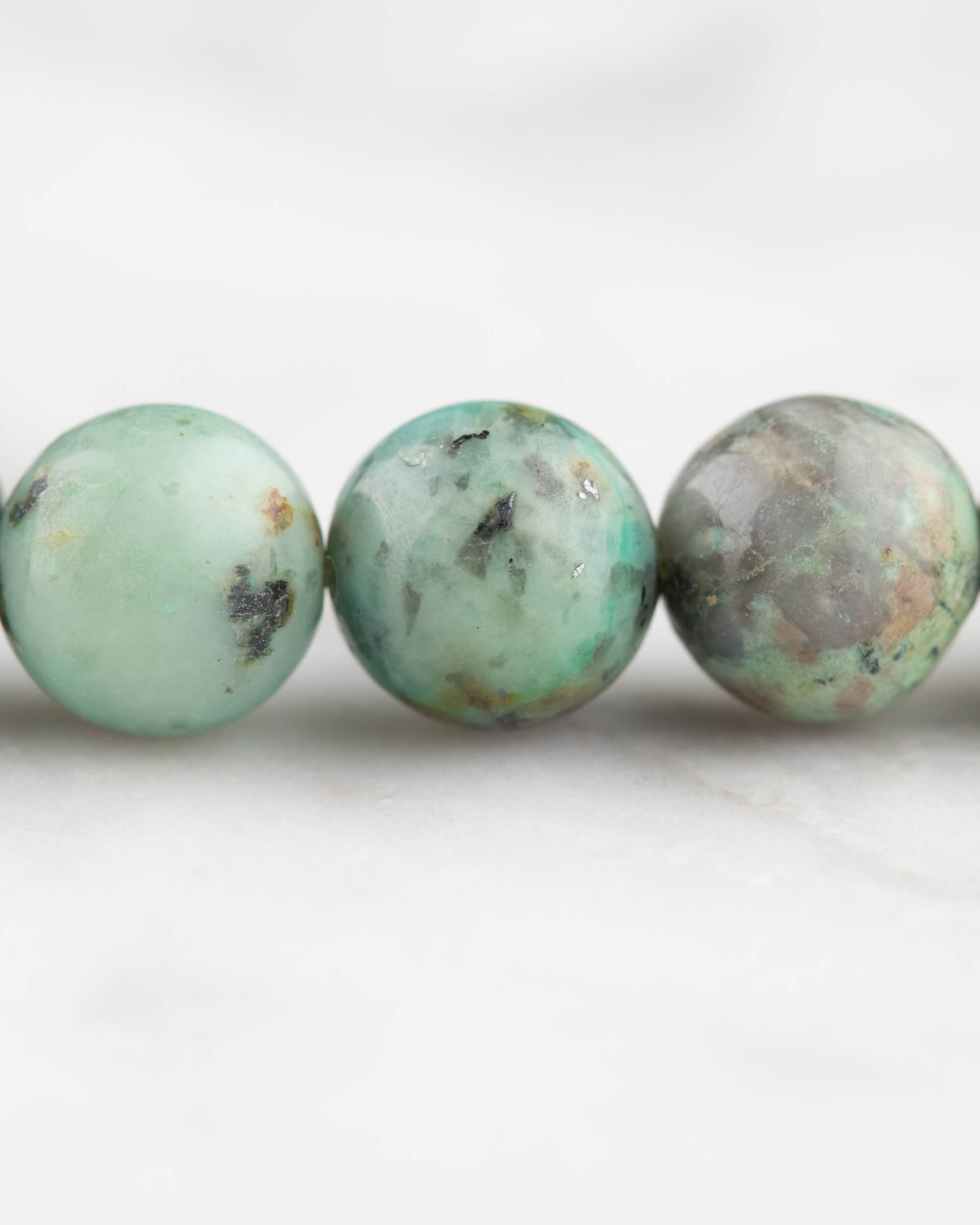 Codificador de Mano Turquesa Africana 34 cm - Evolución y Voz Veraz (Agesta)