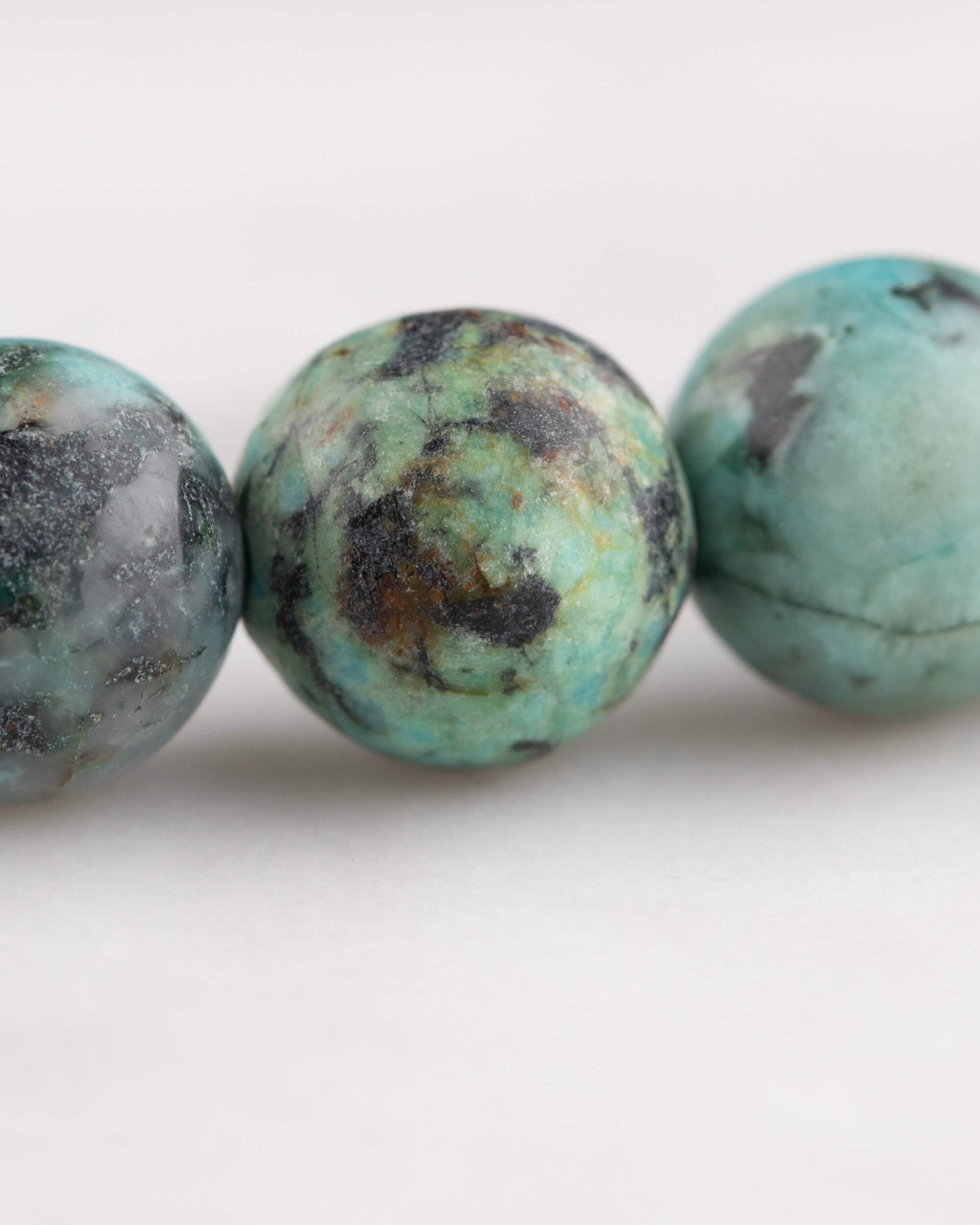 Codificador de Mano Turquesa Africana 34 cm - Evolución y Voz Veraz (Agesta)