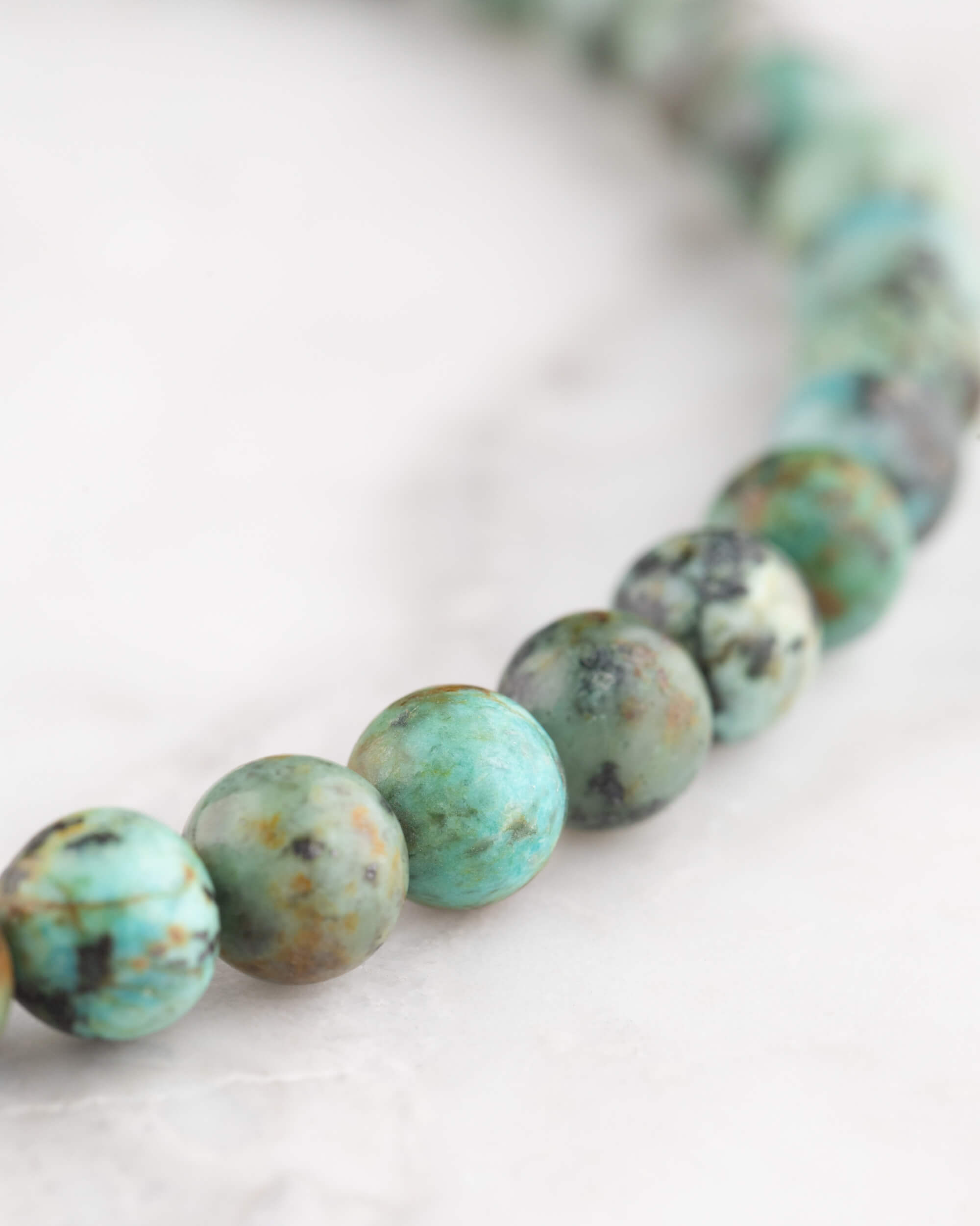 Codificador de Mano Turquesa Africana 34 cm - Evolución y Voz Veraz (Agesta)