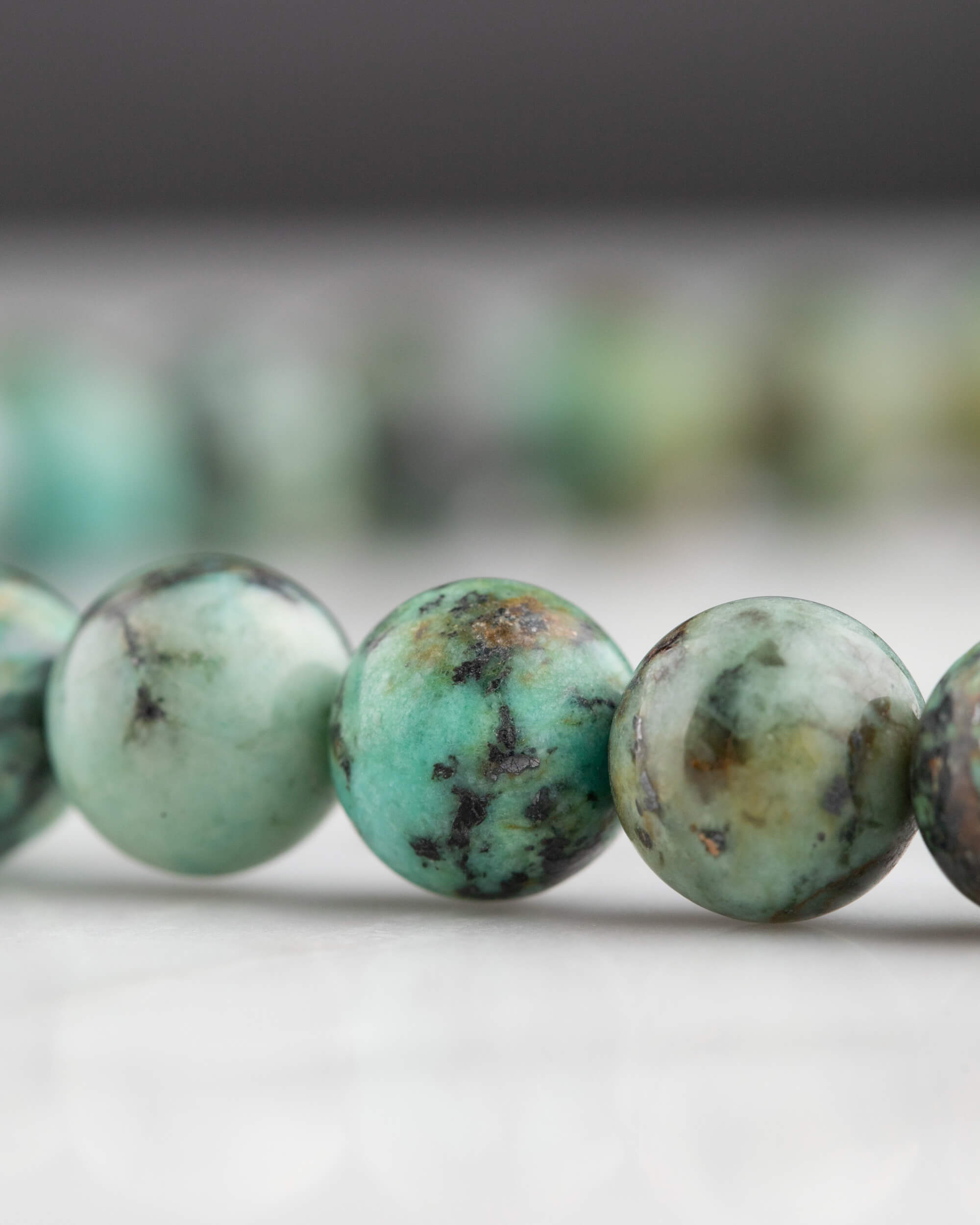 Codificador de Mano Turquesa Africana 34 cm - Evolución y Voz Veraz (Agesta)