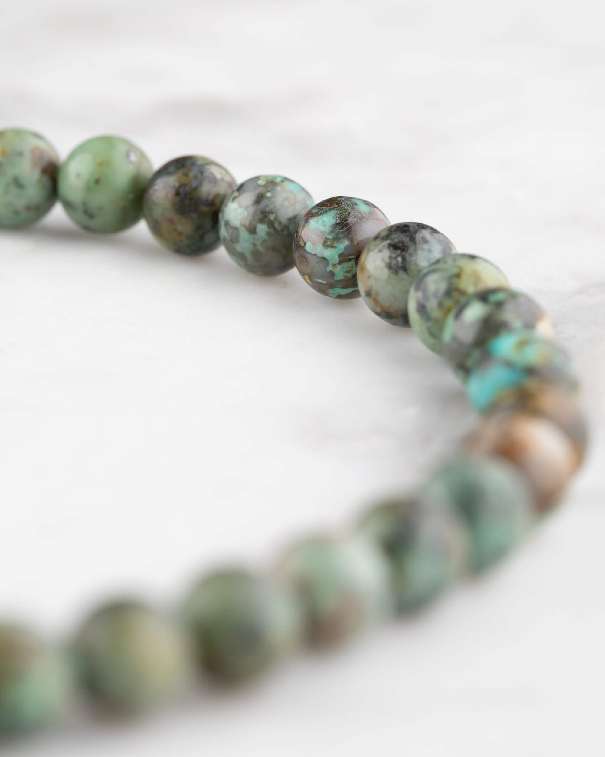 Codificador de Mano Turquesa Africana 34 cm - Evolución y Voz Veraz (Agesta)