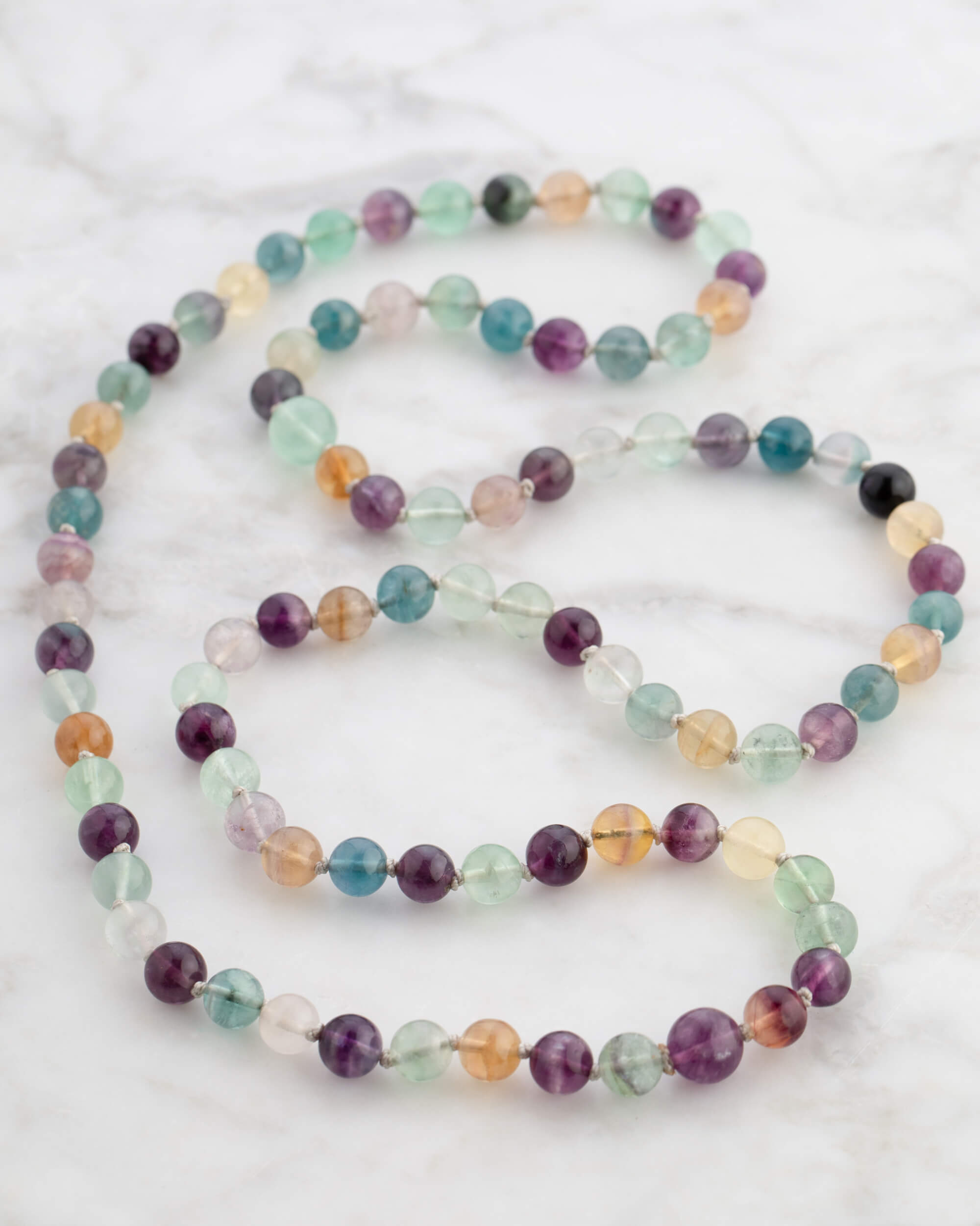 Codificador Doble de Fluorita Arcoíris (8 mm)