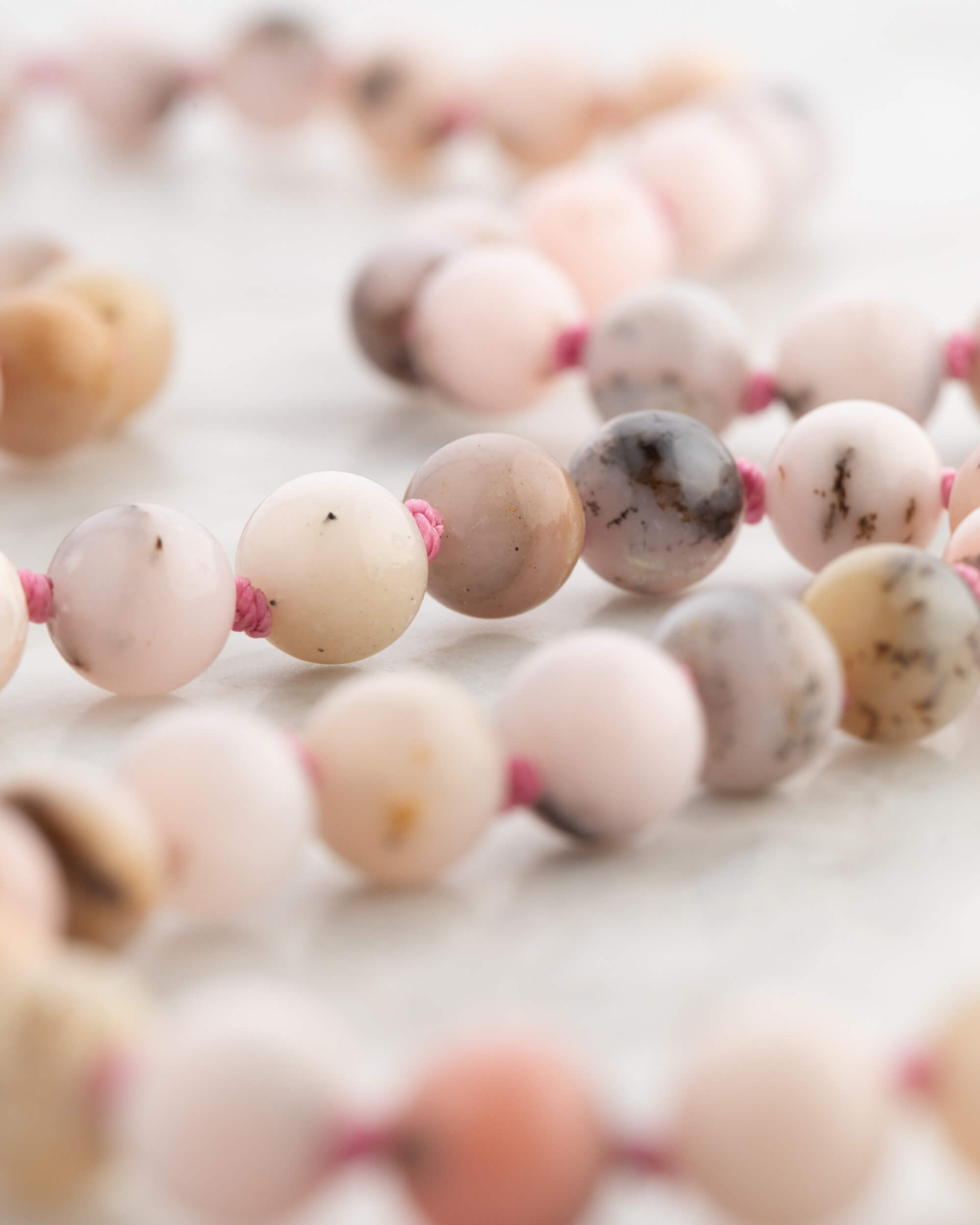 Codificador Doble Ópalo Rosa y Rodonita 90 Cuentas - Ternura y Estructura (Agesta)