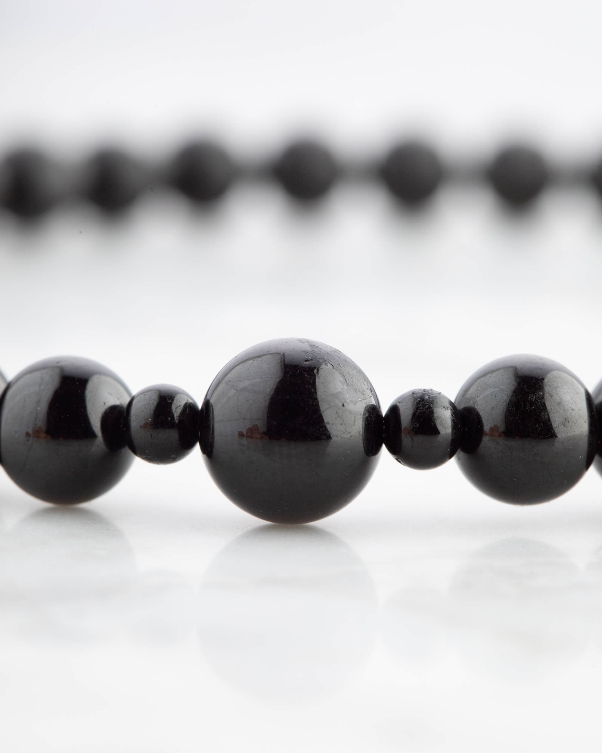 Codificador de Mano Turmalina Negra 34 cm - Protección y Raíz (Agesta)