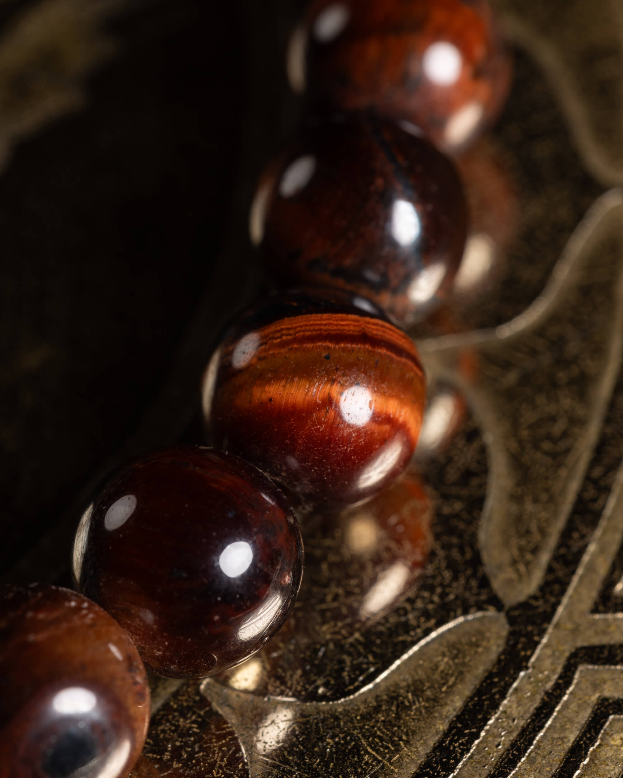 Pulsera de Ojo de Tigre Rojo 6 mm - Acción Enraizada