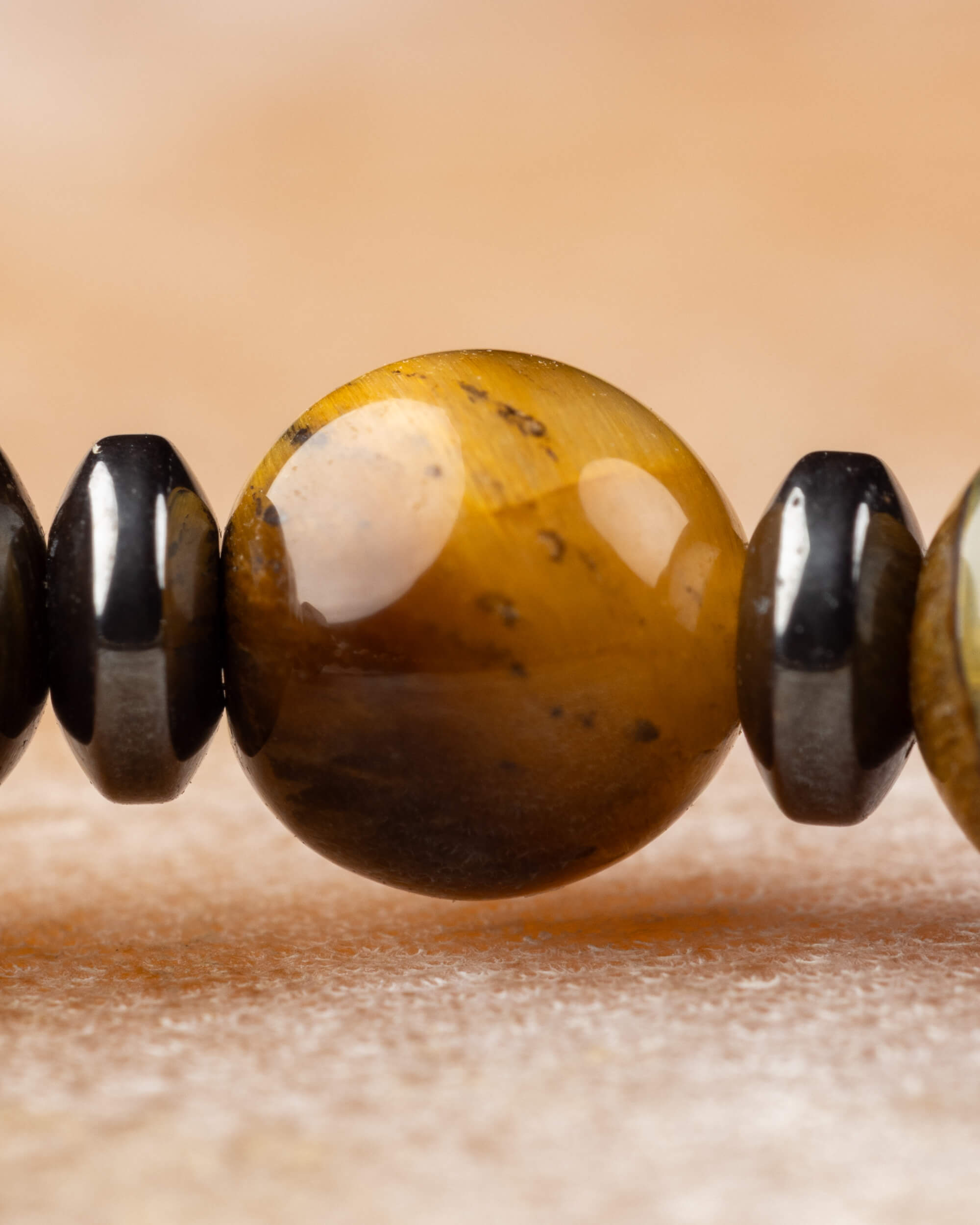 Pulsera de Ojo de Tigre y Hematita con Icosaedro - Eje Protector