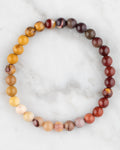 Pulsera de Jaspe Mokaita de 6 mm, pieza completa sobre mármol claro