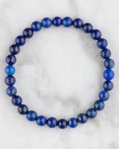 Pulsera de Lapislázuli de 6 mm, pieza completa sobre mármol claro