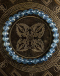 Pulsera de Aguamarina Santa María de 6 mm, pieza completa en círculo sobre placa grabada