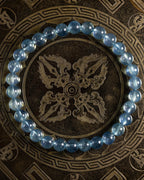 Pulsera de Aguamarina Santa María de 6 mm, pieza completa en círculo sobre placa grabada