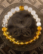 Pulsera Arinna de Piedra Luna, Cuarzo Transparente y Ámbar, pieza completa sobre disco grabado