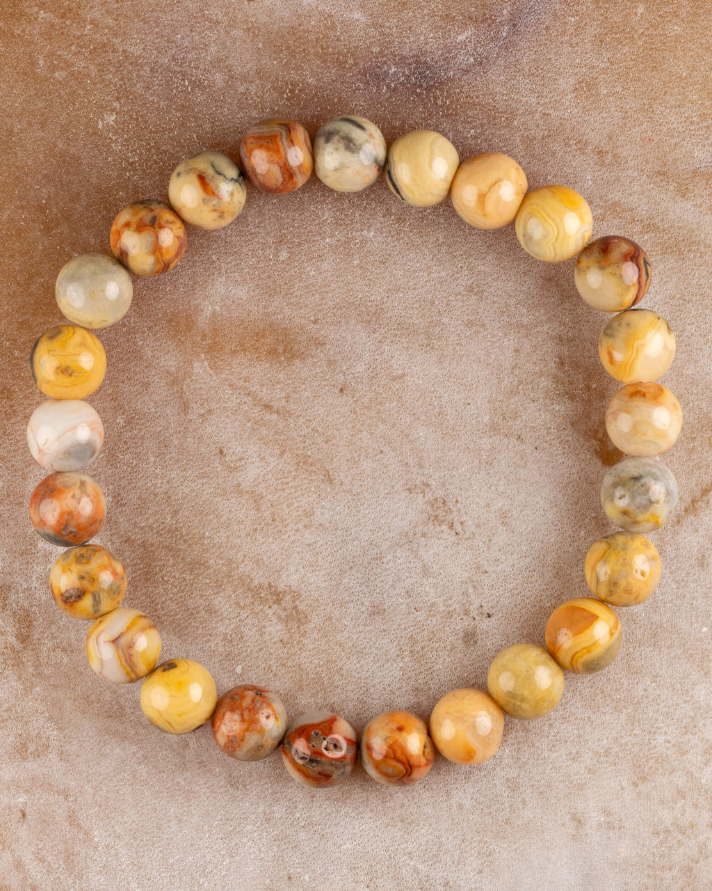 Pulsera de Ágata Mexicana de 8 mm, pieza completa en círculo sobre superficie clara