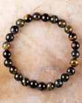 Pulsera de Ojo de Tigre Bicolor de 8 mm, pieza completa en círculo sobre piedra clara
