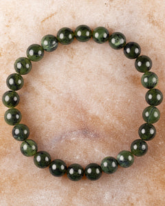 Pulsera de Jade Verde Oscuro de 8 mm, pieza completa en círculo sobre superficie clara