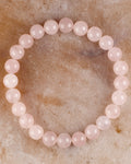 Pulsera de Cuarzo Rosa de 8 mm, pieza completa sobre superficie clara