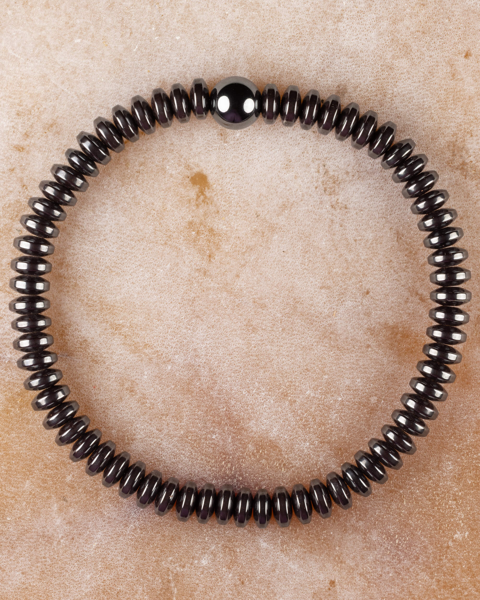 Pulsera de Hematita en discos de 3x6 mm, pieza completa circular con cuenta esferica central