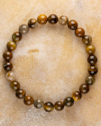 Pulsera de Pietersita Amarilla de 8 mm, pieza completa en círculo sobre superficie clara