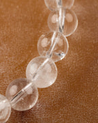 Cuentas de Cuarzo Transparente en fila, brillo y transparencia visibles
