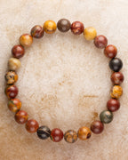 Pulsera de Jaspe Picasso de 8 mm, pieza completa en círculo sobre superficie clara