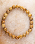 Pulsera de Jaspe Paisaje de 8 mm, pieza completa en círculo sobre superficie clara