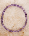 Pulsera de Amatista de 4 mm, pieza completa en círculo sobre superficie clara