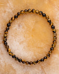 Pulsera de Ojo de Tigre de 4 mm, pieza completa en círculo sobre superficie clara