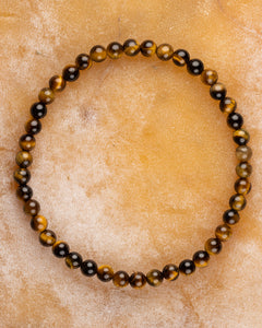 Pulsera de Ojo de Tigre de 4 mm, pieza completa en círculo sobre superficie clara