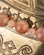 Detalle macro de cuentas de Piedra Sol Naranja de distintos tamanos en fila