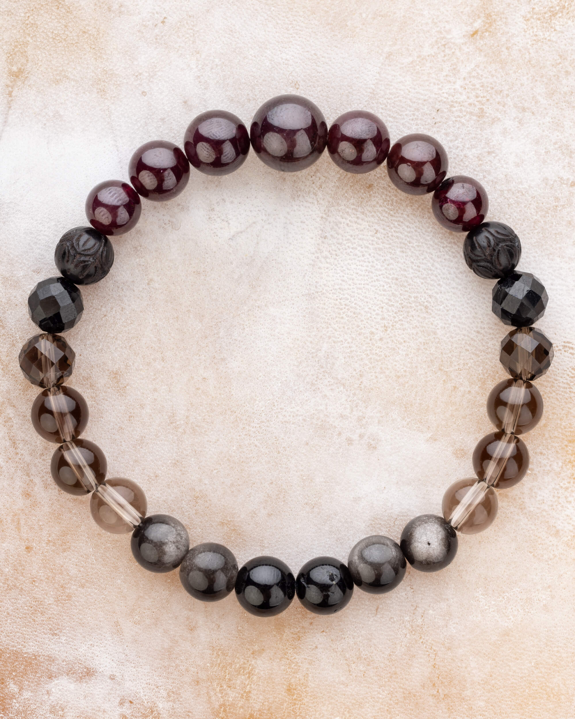 Pulsera completa con esferas de Granate Estrella, Turmalina Negra, Obsidiana Plateada y Cuarzo Ahumado